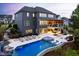 Expansive backyard with a pool, a covered patio, a hot tub, and lush landscaping at 3215 Bellamy Ridge Dr, Apex, NC 27523