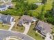 Stunning aerial view of the home with a pool, landscaped backyard, and mature trees at 3215 Bellamy Ridge Dr, Apex, NC 27523