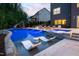 Backyard retreat featuring a pool, a hot tub, in-pool seating and sun loungers for relaxation at 3215 Bellamy Ridge Dr, Apex, NC 27523