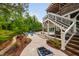 Spacious backyard featuring a luxurious pool, outdoor seating, and lush landscaping at 3215 Bellamy Ridge Dr, Apex, NC 27523