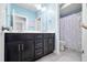 Bathroom with double vanity sinks and a shower featuring a patterned curtain at 3215 Bellamy Ridge Dr, Apex, NC 27523