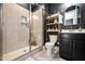 Modern bathroom featuring a glass-enclosed shower, vanity with gold fixtures, and stylish decor at 3215 Bellamy Ridge Dr, Apex, NC 27523