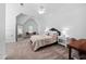 Bright bedroom with a soaring ceiling, plush carpet, and a cozy seating area at 3215 Bellamy Ridge Dr, Apex, NC 27523