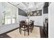Stylish dining room features elegant lighting, coffered ceilings, and a large window providing natural light at 3215 Bellamy Ridge Dr, Apex, NC 27523