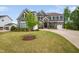 Attractive two-story home with stone details, well-manicured lawn and a basketball hoop at 3215 Bellamy Ridge Dr, Apex, NC 27523