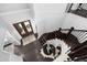 Grand foyer boasts dark wood floors, stairs, and double doors with transom windows providing abundant natural light at 3215 Bellamy Ridge Dr, Apex, NC 27523