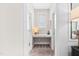 Cozy hallway nook with built-in desk, overhead window, and neutral color palette at 3215 Bellamy Ridge Dr, Apex, NC 27523