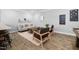 Sitting room with a sofa, chairs, coffee table, and decor, with plank flooring at 3215 Bellamy Ridge Dr, Apex, NC 27523