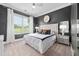 Serene main bedroom with a large window, neutral carpet, and stylish decor at 3215 Bellamy Ridge Dr, Apex, NC 27523
