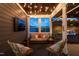 Inviting screened-in porch with comfortable seating and an outdoor kitchen view at 3215 Bellamy Ridge Dr, Apex, NC 27523
