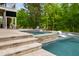 Poolside hot tub next to the main pool with lounge chairs for relaxation at 3215 Bellamy Ridge Dr, Apex, NC 27523