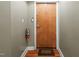 Condo front door has a welcome mat and a wall mounted fire extinguisher at 323 W Main St # C, Durham, NC 27701