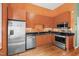 Efficient kitchen features stainless steel appliances, granite countertops, and hardwood floors at 323 W Main St # C, Durham, NC 27701