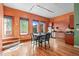 Stylish kitchen with stainless steel appliances and a dining area with natural light at 323 W Main St # C, Durham, NC 27701