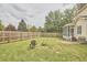 Lush backyard features a fire pit, a grill and patio for outdoor gatherings at 3809 Victorian Grace Ln, Apex, NC 27539