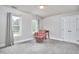 Bright bedroom featuring neutral walls, plush carpet, and large windows offering natural light at 3809 Victorian Grace Ln, Apex, NC 27539