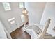 Bright entryway with hardwood floors, a staircase, and ample natural light at 3809 Victorian Grace Ln, Apex, NC 27539