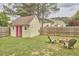 Well-kept backyard shed, complemented by a fire pit and outdoor seating at 3809 Victorian Grace Ln, Apex, NC 27539