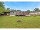 Home's spacious yard features a fire pit for outdoor entertainment and backyard cookouts at 3902 Booker Ave, Durham, NC 27713