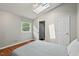 Comfortable bedroom with natural light, hardwood floors, and a view to the outdoors at 3902 Booker Ave, Durham, NC 27713