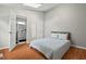 Bright bedroom with hardwood floors, sky light and ensuite bathroom featuring natural light at 3902 Booker Ave, Durham, NC 27713