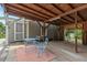 Large carport featuring a seating area and natural light with a gray painted house at 3902 Booker Ave, Durham, NC 27713