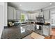 Updated kitchen featuring stainless steel appliances and gray cabinets at 3902 Booker Ave, Durham, NC 27713