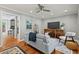 Open-concept living room featuring hardwood floors and neutral tones at 3902 Booker Ave, Durham, NC 27713