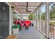 Inviting screened porch with stylish furnishings and ceiling fan at 3902 Booker Ave, Durham, NC 27713