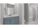 Updated bathroom with walk-in shower and vanity at 400 Chickasaw Plum Dr, Holly Springs, NC 27540
