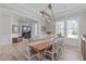 Bright dining room adjacent to the home office featuring a large table at 400 Chickasaw Plum Dr, Holly Springs, NC 27540