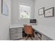 A dedicated home office space features a built-in desk, and natural light at 400 Chickasaw Plum Dr, Holly Springs, NC 27540