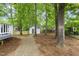 Beautiful backyard with plenty of trees, a shed and back deck at 404 Trappers Run Dr, Cary, NC 27513