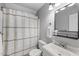 Full bathroom features a shower-tub, vanity with sink and modern fixtures at 404 Trappers Run Dr, Cary, NC 27513