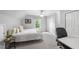 Bright bedroom with sloped ceiling features desk, closet, and comfortable bed at 404 Trappers Run Dr, Cary, NC 27513