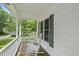 A cozy front porch with white rocking chairs offers a relaxing outdoor space at 404 Trappers Run Dr, Cary, NC 27513