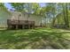 Exterior view of home showing backyard and storage shed at 4041 Brook Cross Dr, Apex, NC 27539