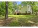 Exterior home view of a nicely landscaped backyard and patio at 4041 Brook Cross Dr, Apex, NC 27539