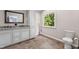 Bathroom with double sink vanity, granite countertops, and tile flooring at 4041 Brook Cross Dr, Apex, NC 27539