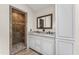 Bathroom with double vanity, granite countertops, and tiled walk-in shower at 4041 Brook Cross Dr, Apex, NC 27539