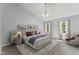 Bright bedroom with a vaulted ceiling, two windows, and neutral color palette at 4041 Brook Cross Dr, Apex, NC 27539