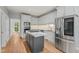 Well-equipped kitchen with modern island, stainless steel appliances, and ample cabinet space at 4041 Brook Cross Dr, Apex, NC 27539