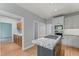 Eat-in kitchen featuring stainless appliances, granite countertops, and wood floors at 4041 Brook Cross Dr, Apex, NC 27539