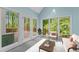 Cozy sunroom with lots of natural light and peaceful view of the backyard at 4041 Brook Cross Dr, Apex, NC 27539