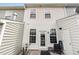 Cozy back patio with seating and charming white exterior, perfect for relaxing at 412 Stone Flower Ln, Raleigh, NC 27603