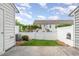 The backyard has grass, fence and a small section of patio at 412 Stone Flower Ln, Raleigh, NC 27603
