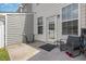The patio has a glass table and chairs, perfect for enjoying the backyard at 412 Stone Flower Ln, Raleigh, NC 27603
