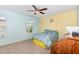 Bedroom with a ceiling fan, carpet floors and a window with a view of the neighborhood at 412 Stone Flower Ln, Raleigh, NC 27603