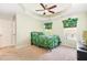 Bedroom featuring tray ceiling, ceiling fan and windows with custom tropical themed valences and blinds at 412 Stone Flower Ln, Raleigh, NC 27603