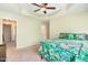 Bedroom featuring tray ceiling, ceiling fan and windows with custom tropical themed valences and blinds at 412 Stone Flower Ln, Raleigh, NC 27603